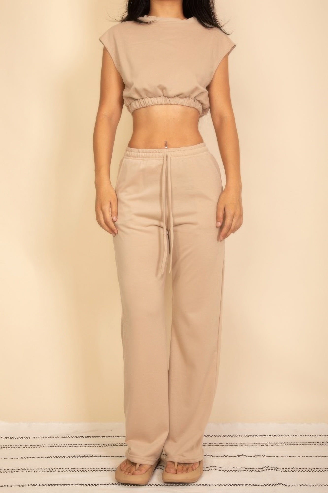 Sand beige sleeveless crop top and wide-leg pants set with faux drawstring