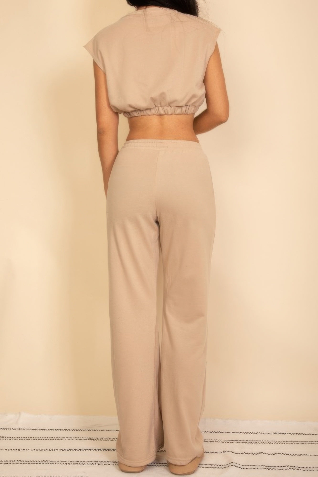 Sand beige back view crop top and wide-leg pants with elastic waistband
