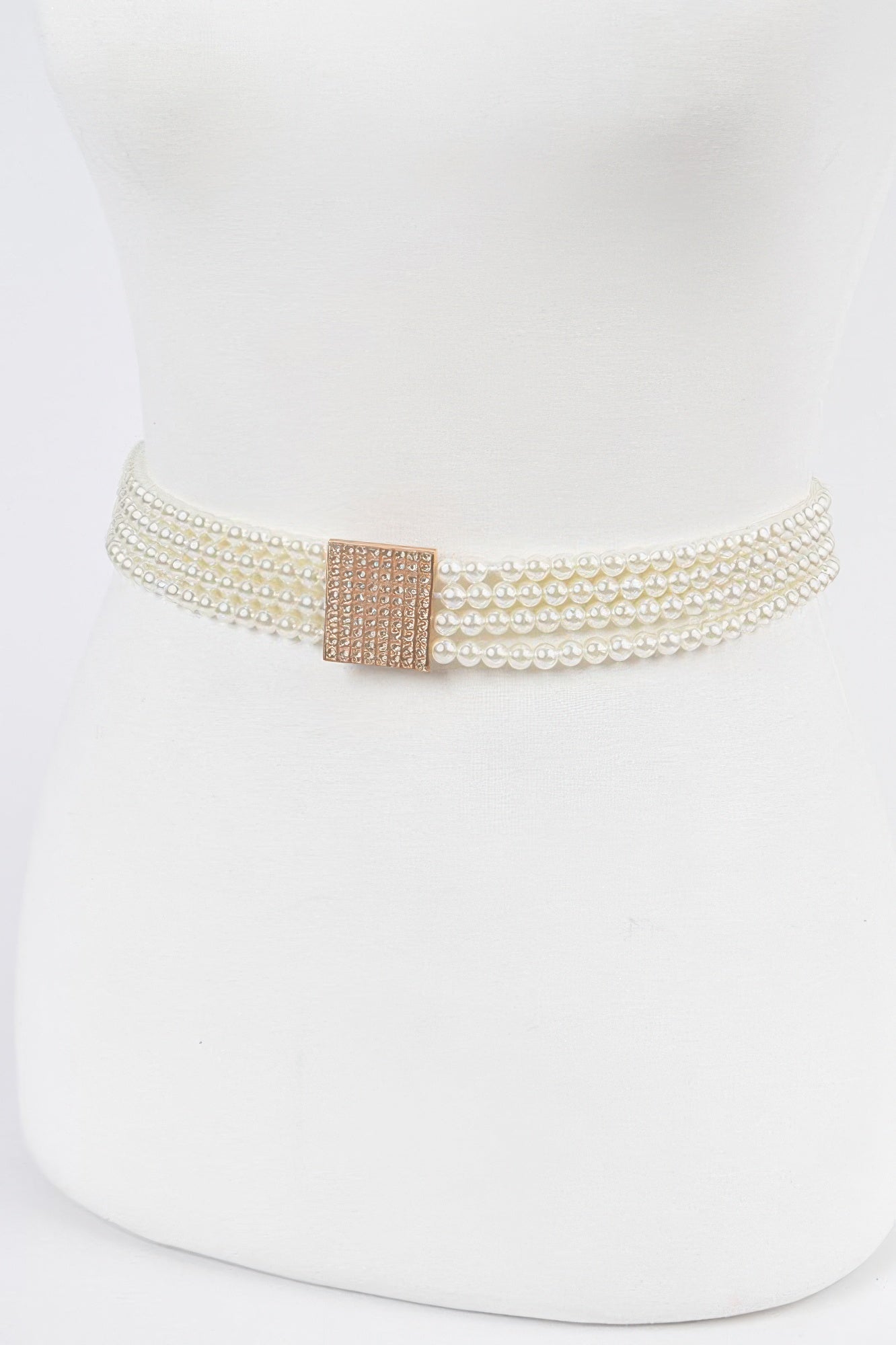 Ivory elastic pearl belt with stacked pearl rows and square rose-gold clasp