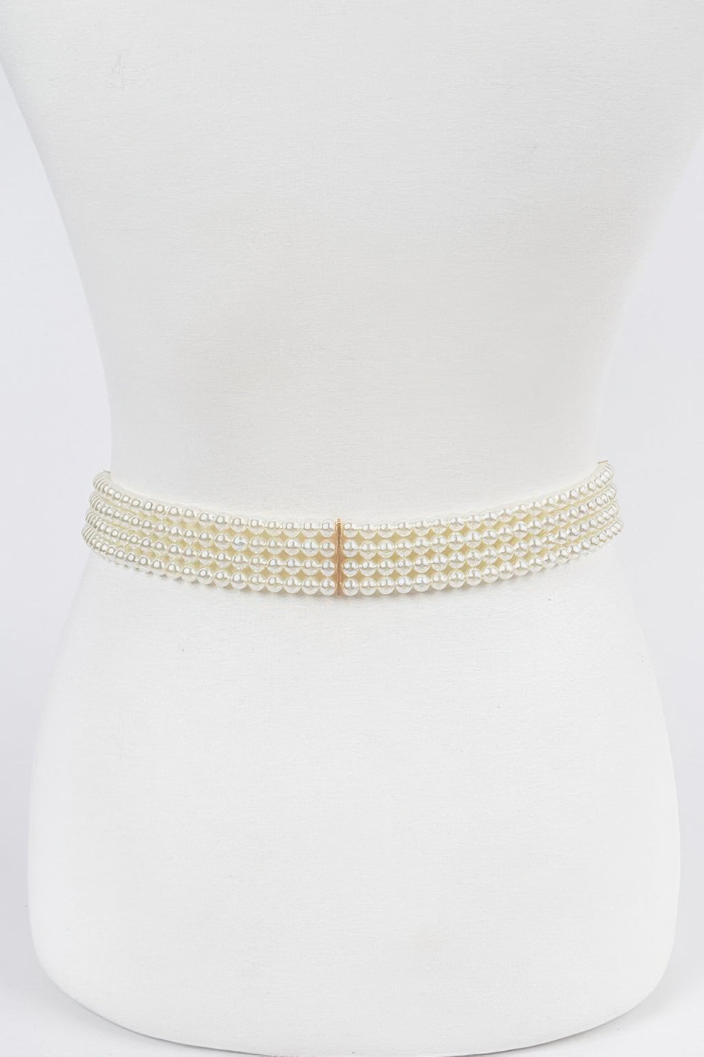 Ivory elastic pearl belt with centered rose-gold square buckle detail