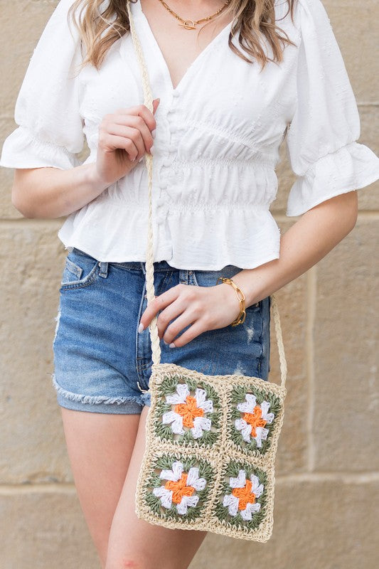 Eliza Crochet Straw Crossbody, straw with orange flower motifs and green leaf accents