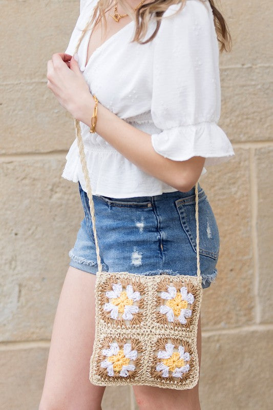 Eliza Crochet Straw Crossbody, woven straw with white and yellow flower appliqués