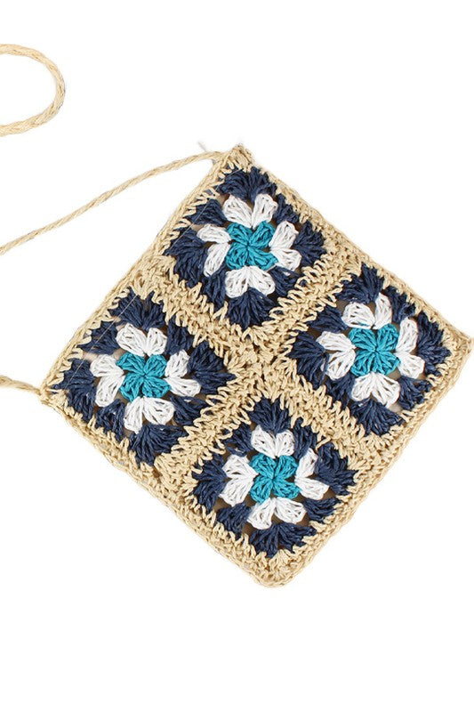 Aili's Corner crochet straw crossbody, navy square with turquoise and white flower appliqués