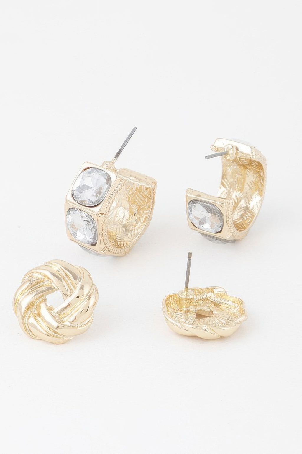 Gold-tone embellished zircon earrings, front view with square clear stones