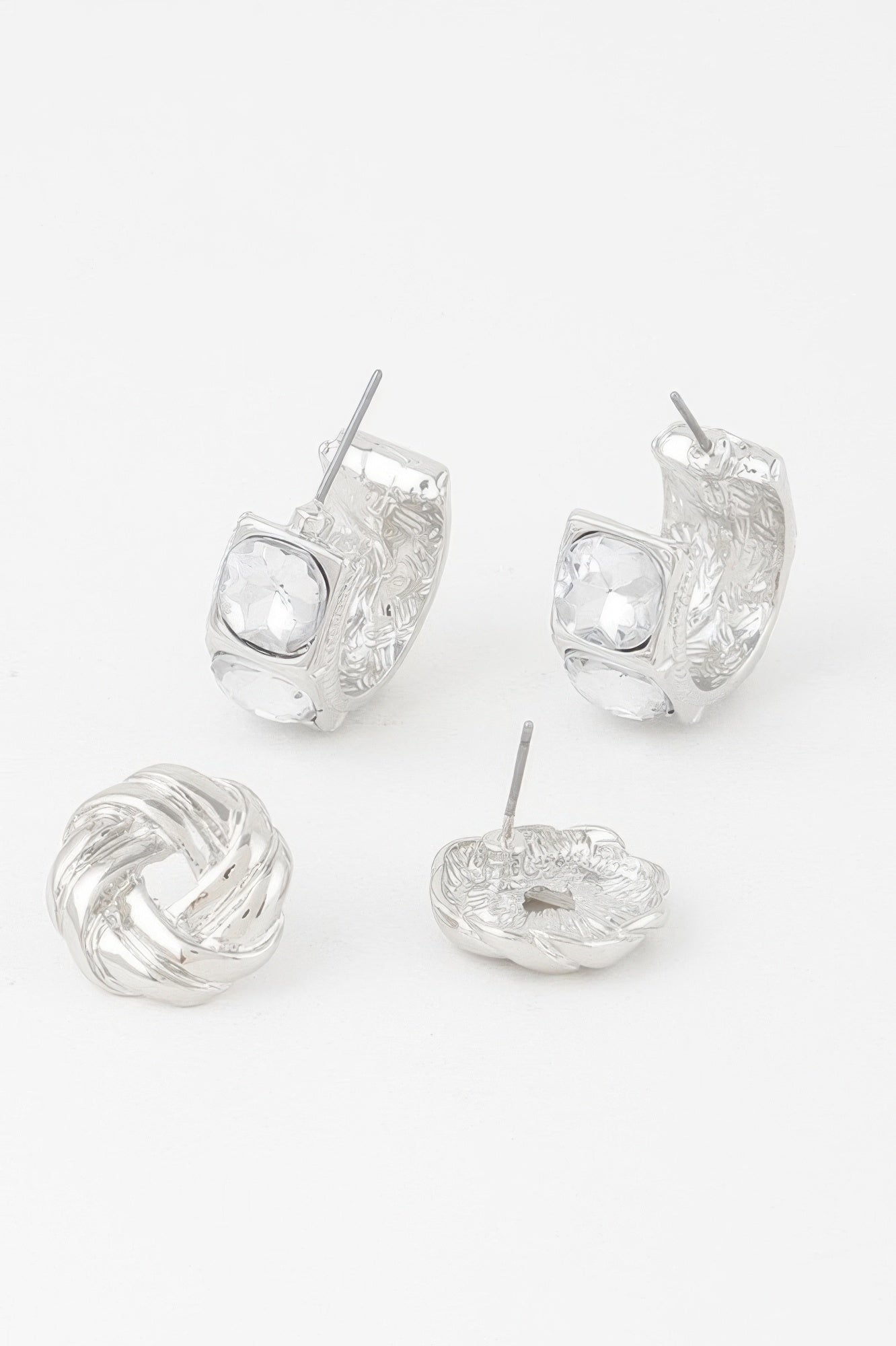 Silver-tone embellished zircon earrings, hoop-style with clear stones and textured band