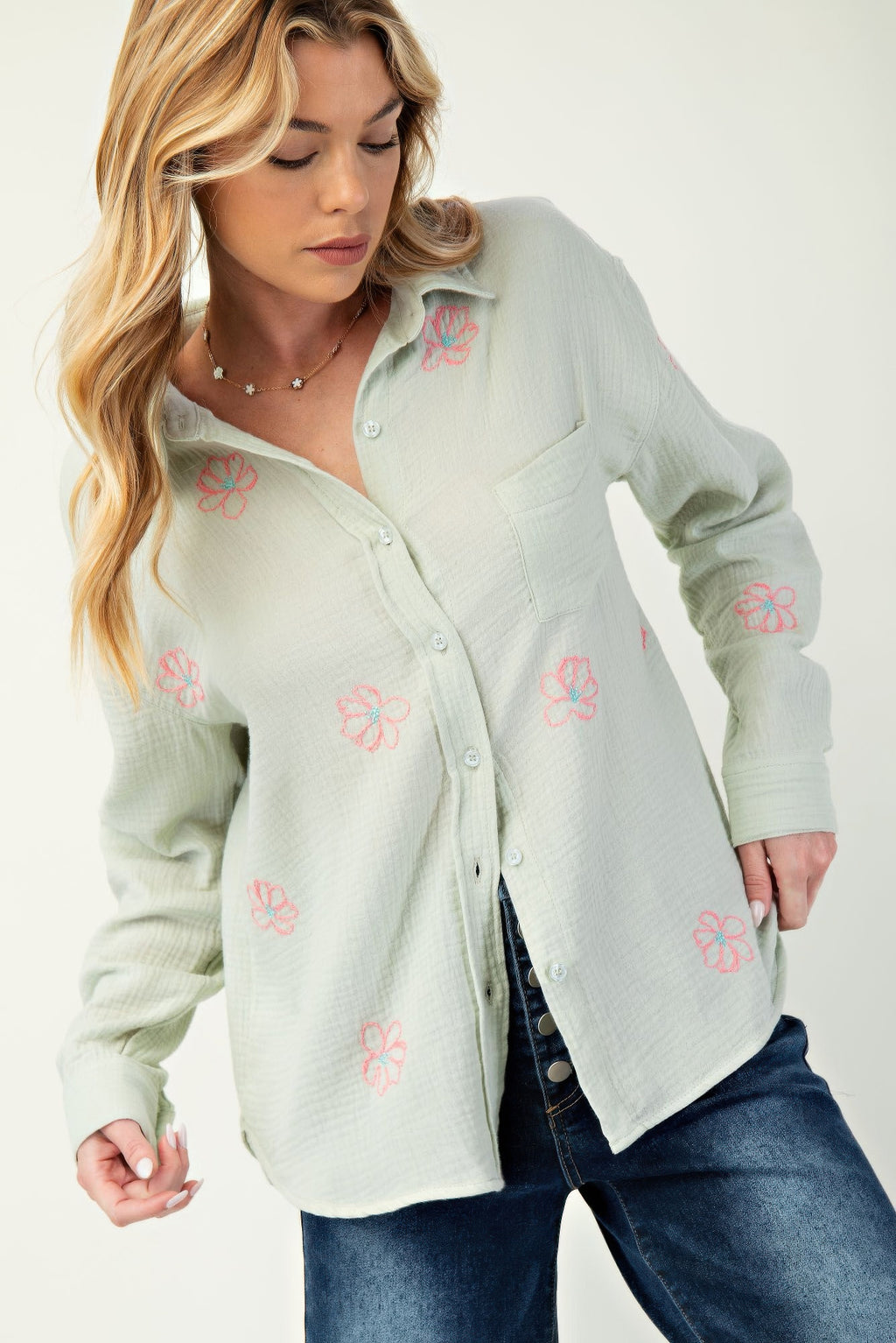 Sage green shirt with pink floral embroidery and button front, chest pocket