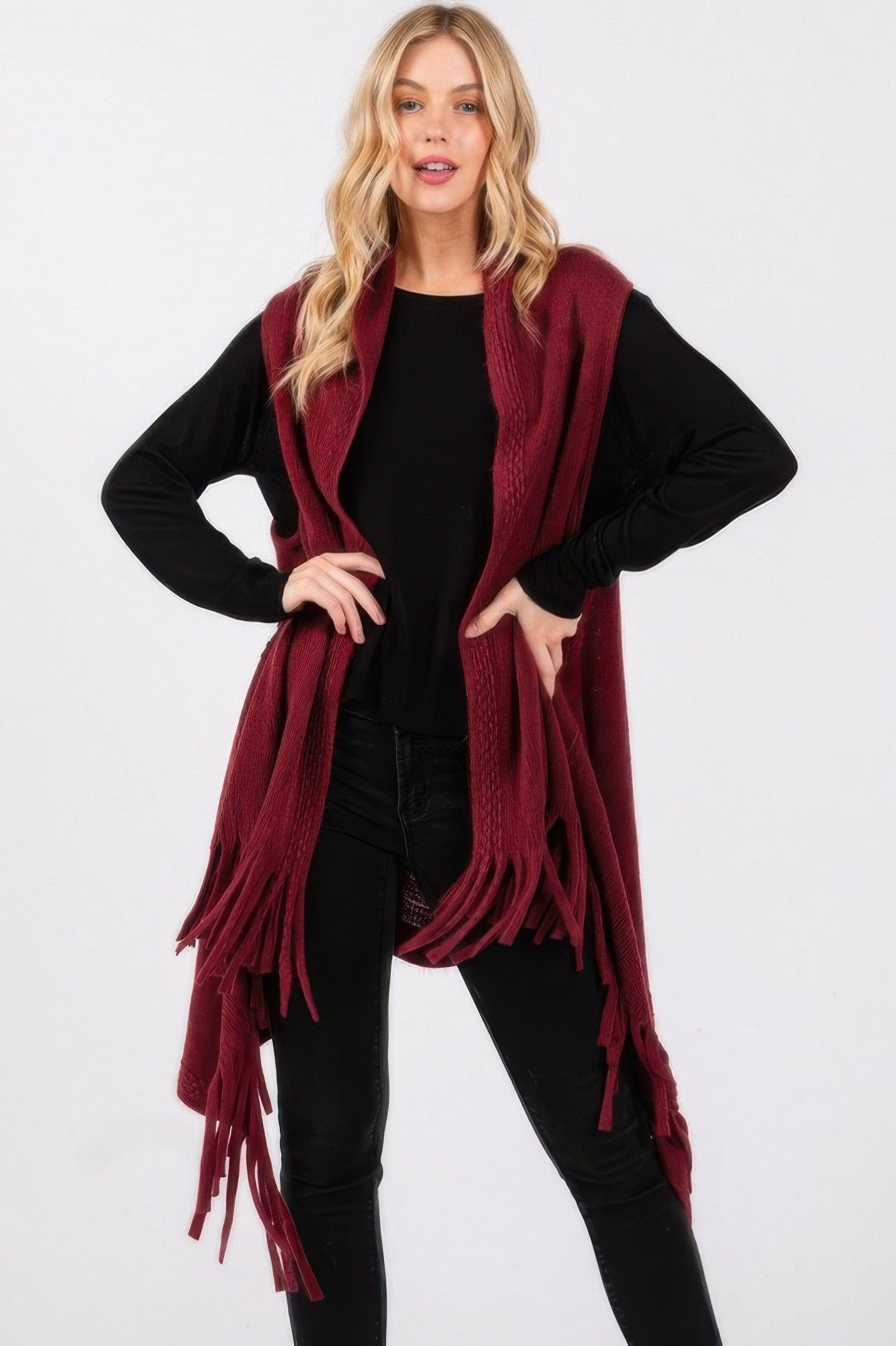 Burgundy knit vest with embossed dotted line texture and tassel fringe