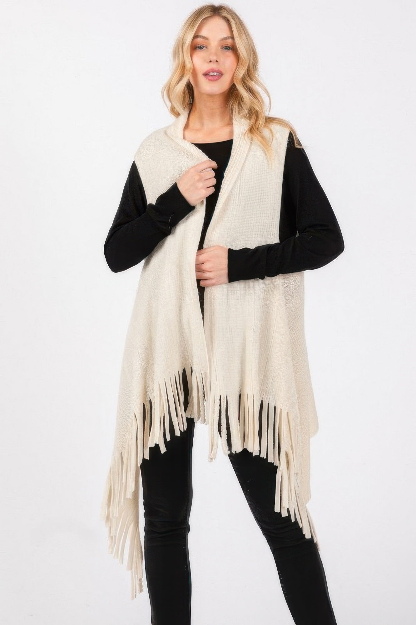 Ivory knit vest with embossed dotted line texture and long tassel fringe