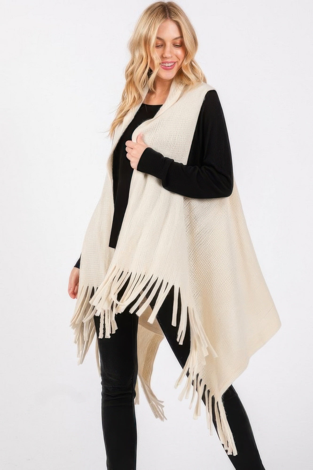 Ivory knit tassel vest with draped front and fringe hem