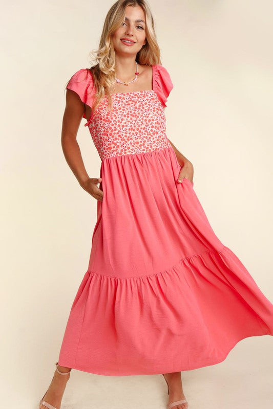 Coral maxi dress with embroidered dot bodice, ruffle hem & side pockets