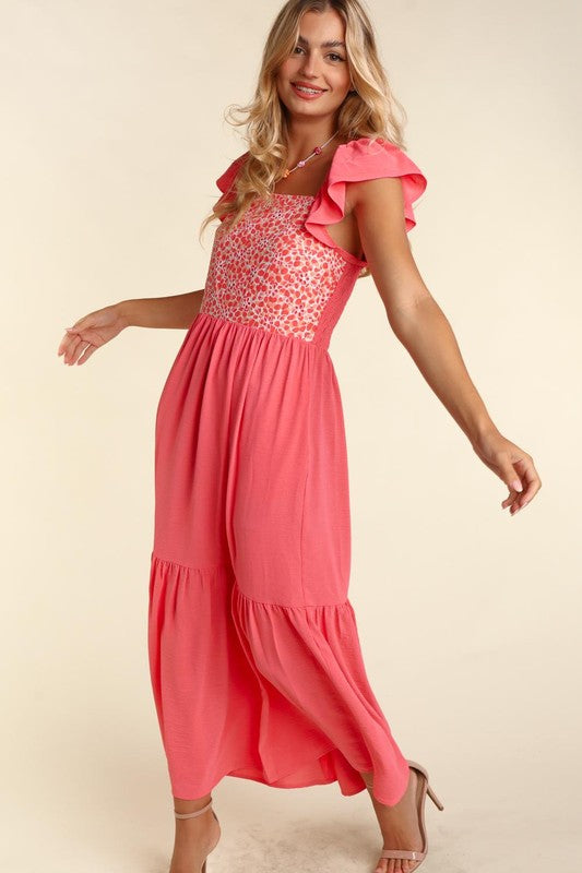 Coral maxi dress with ruffled sleeves, gathered waist, and tiered skirt