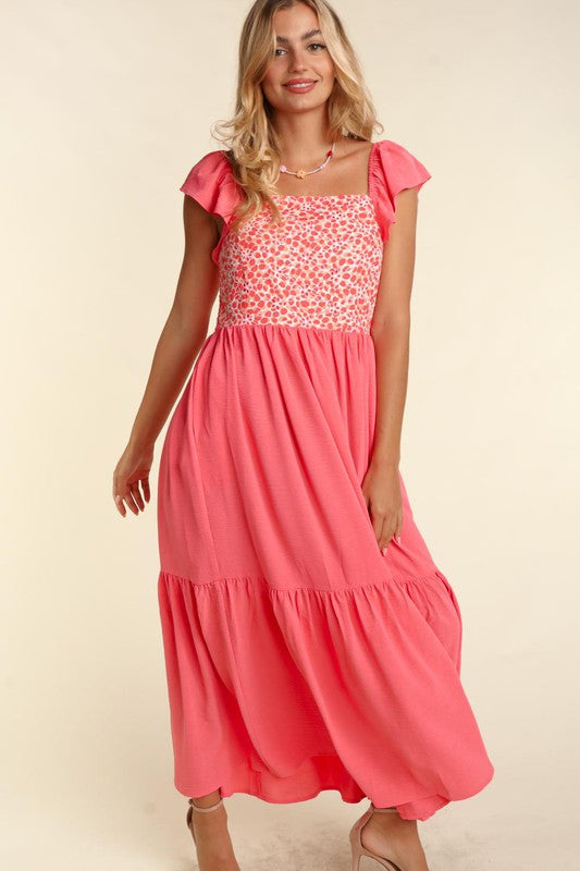 Coral maxi dress with embroidered dot bodice and layered tiers at skirt hem