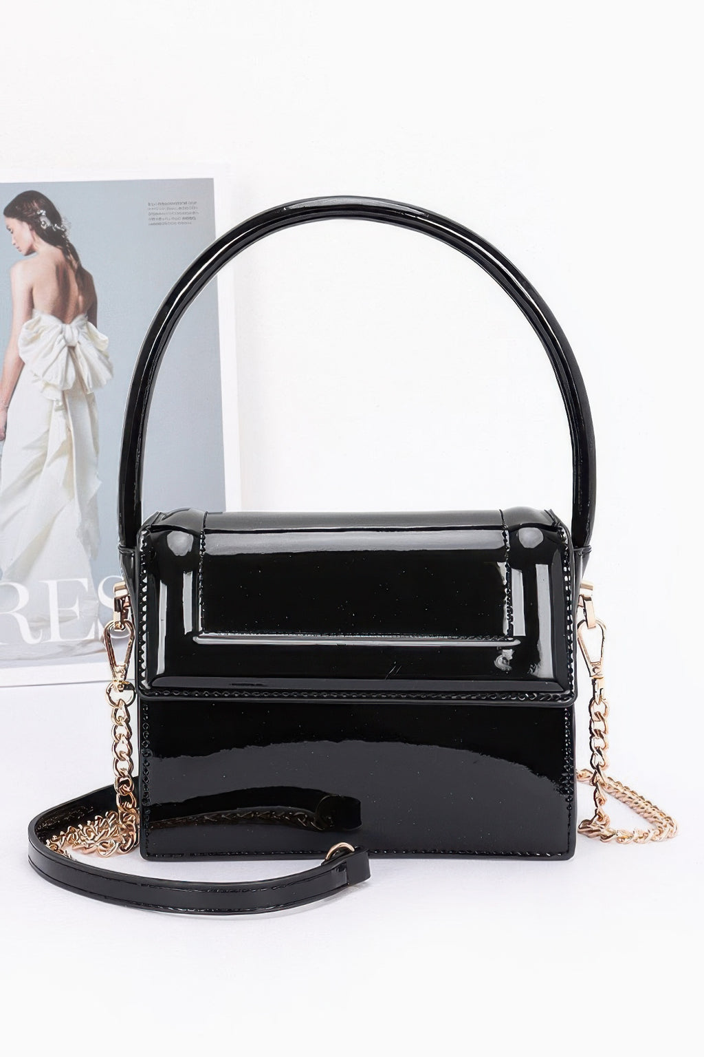 Enamel top handle flap bag, black with glossy finish and gold-tone hardware