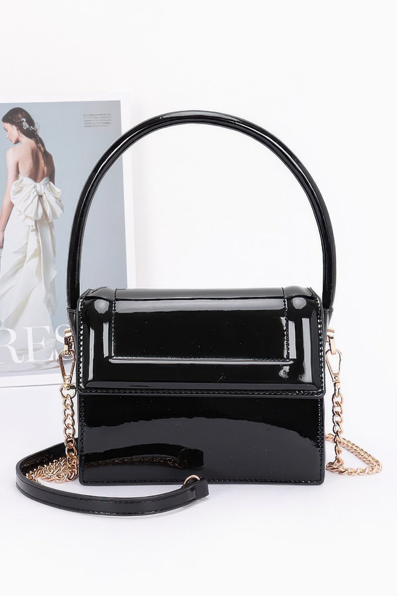Enamel top handle flap bag, black with glossy finish and gold-tone hardware
