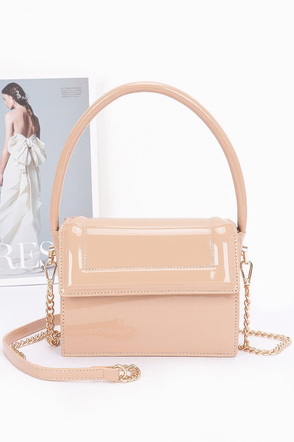 Enamel top handle flap bag, beige/nude color with glossy flap and gold-tone chains
