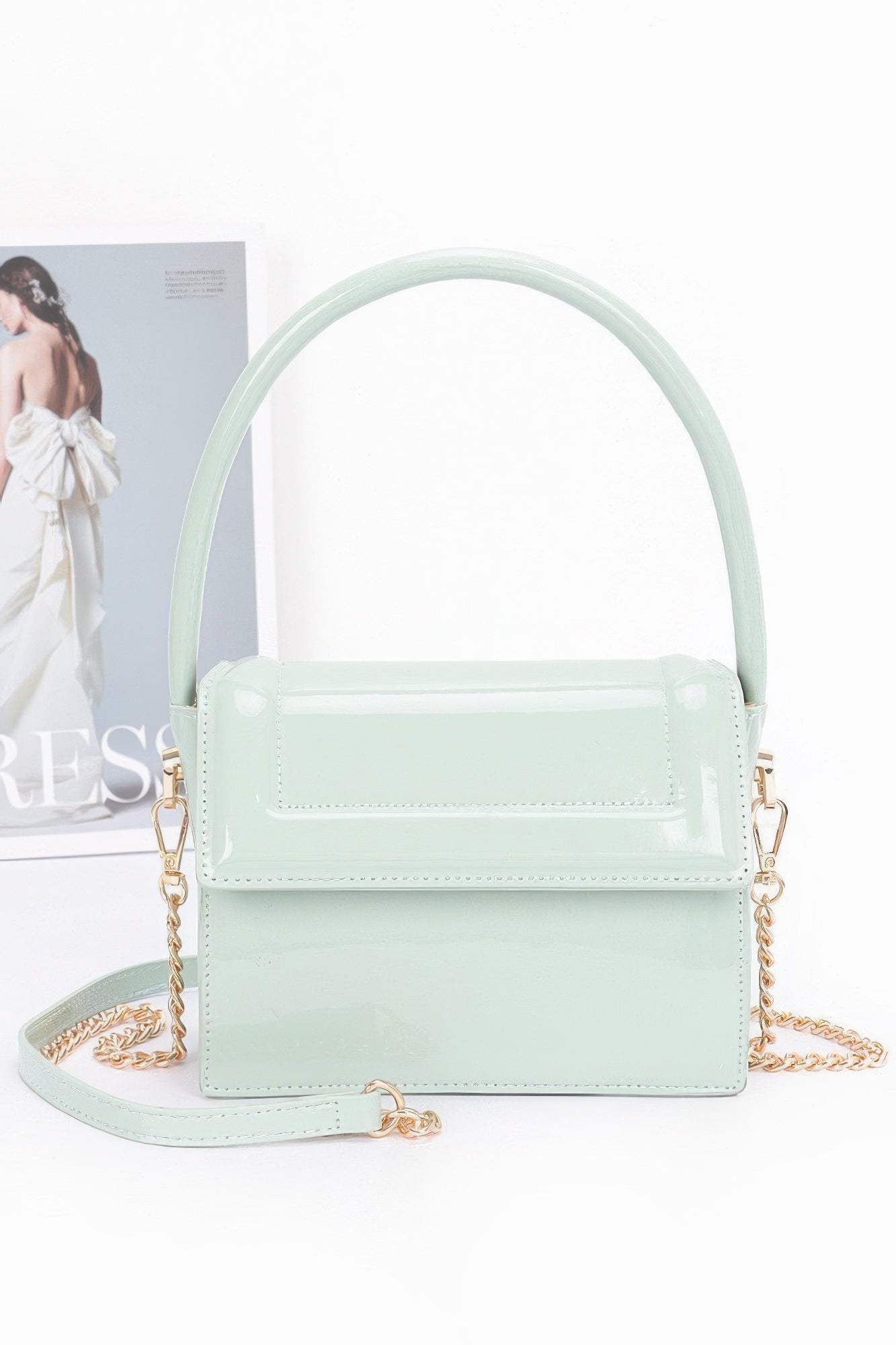 Enamel top handle flap bag, mint green with glossy finish and gold-tone hardware