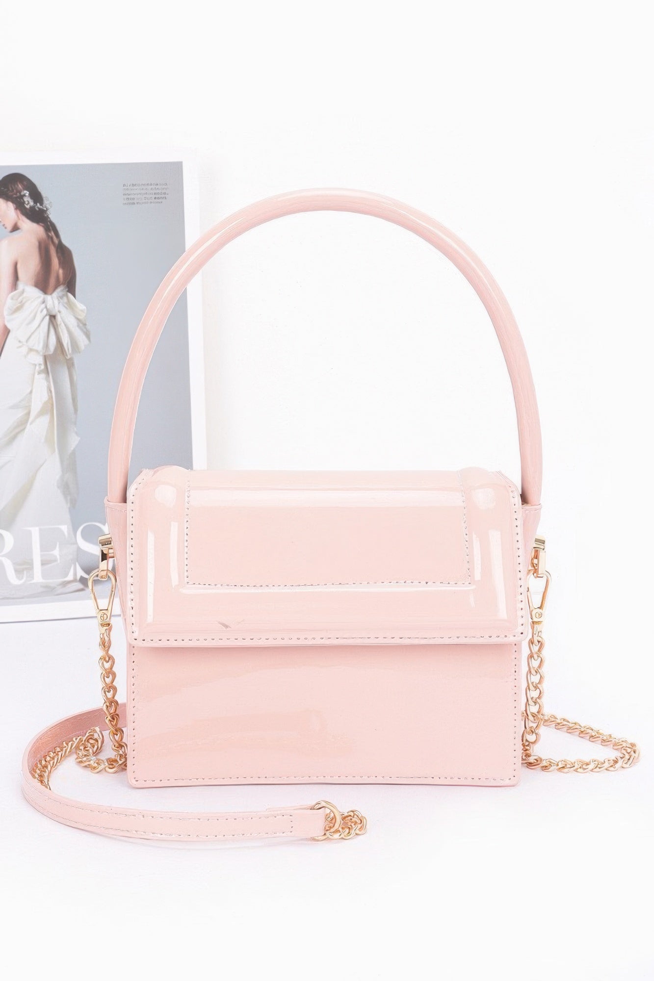 Enamel top handle flap bag, light pink with glossy flap and gold-tone chain strap