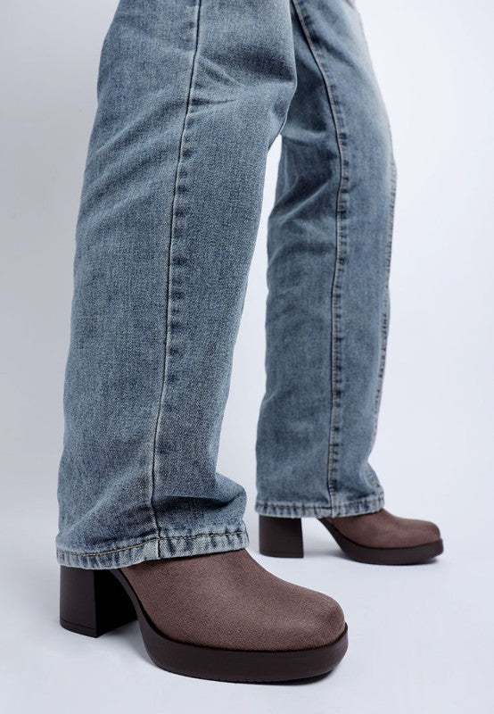 Taupe microfiber sock boot with block heel, worn with light-wash jeans, side zipper