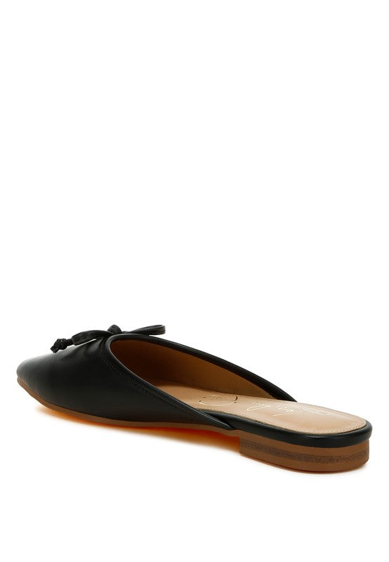 Black slip-on flat mule, side view with bow at the toe and open back