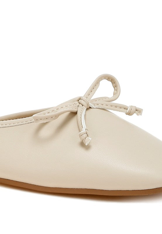 Beige flat mule bow detail with tied laces at the top