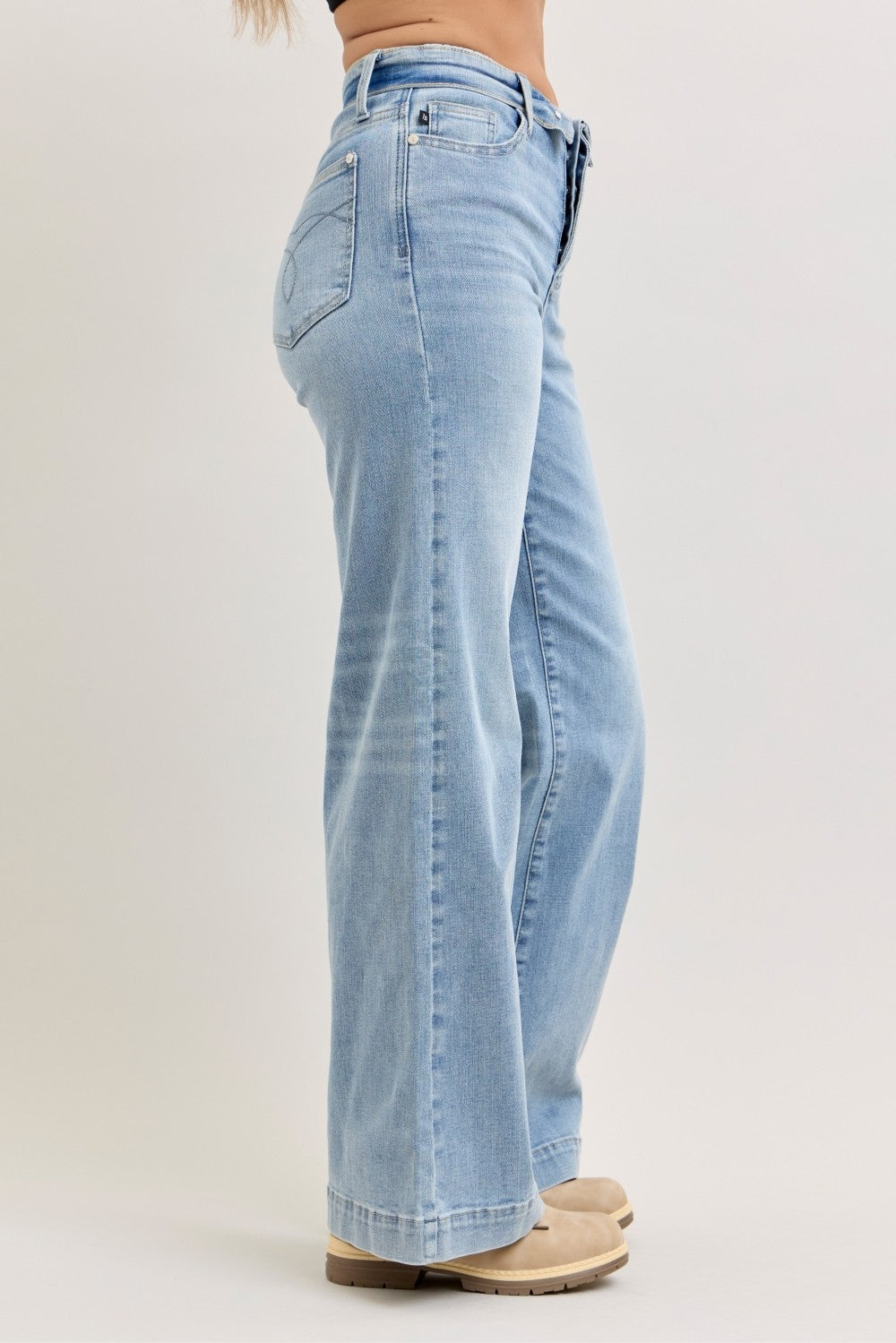 Light-wash wide-leg jeans side view with fold-over mid-rise waistband