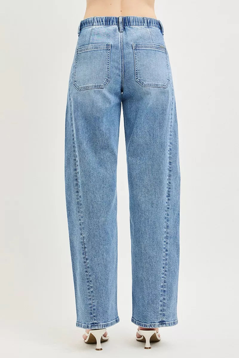Back view light wash relaxed-fit jeans with two patch pockets and elastic waist