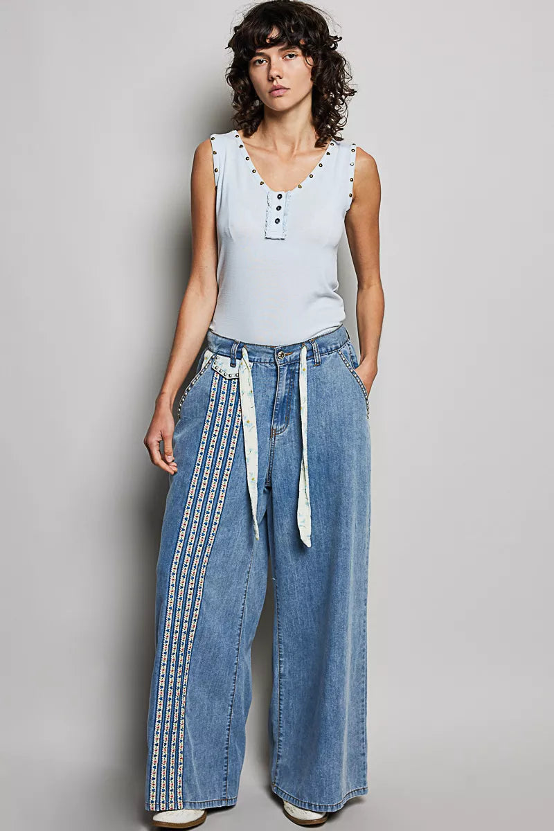 Baby blue sleeveless tank with studded V-neck trim and button placket