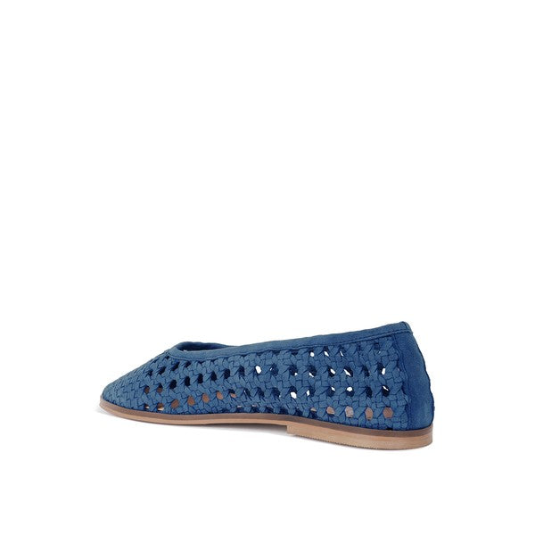 Blue suede ballet flats, side view with perforated upper and low tan sole