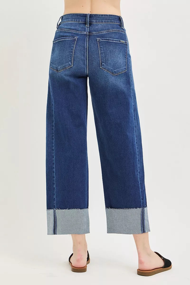 Back view dark blue barrel cuff crop jeans with patch pockets and contrast cuff hem