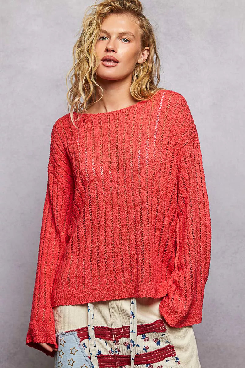 Red open-knit pullover sweater, long sleeves and round neckline with ribbed trim