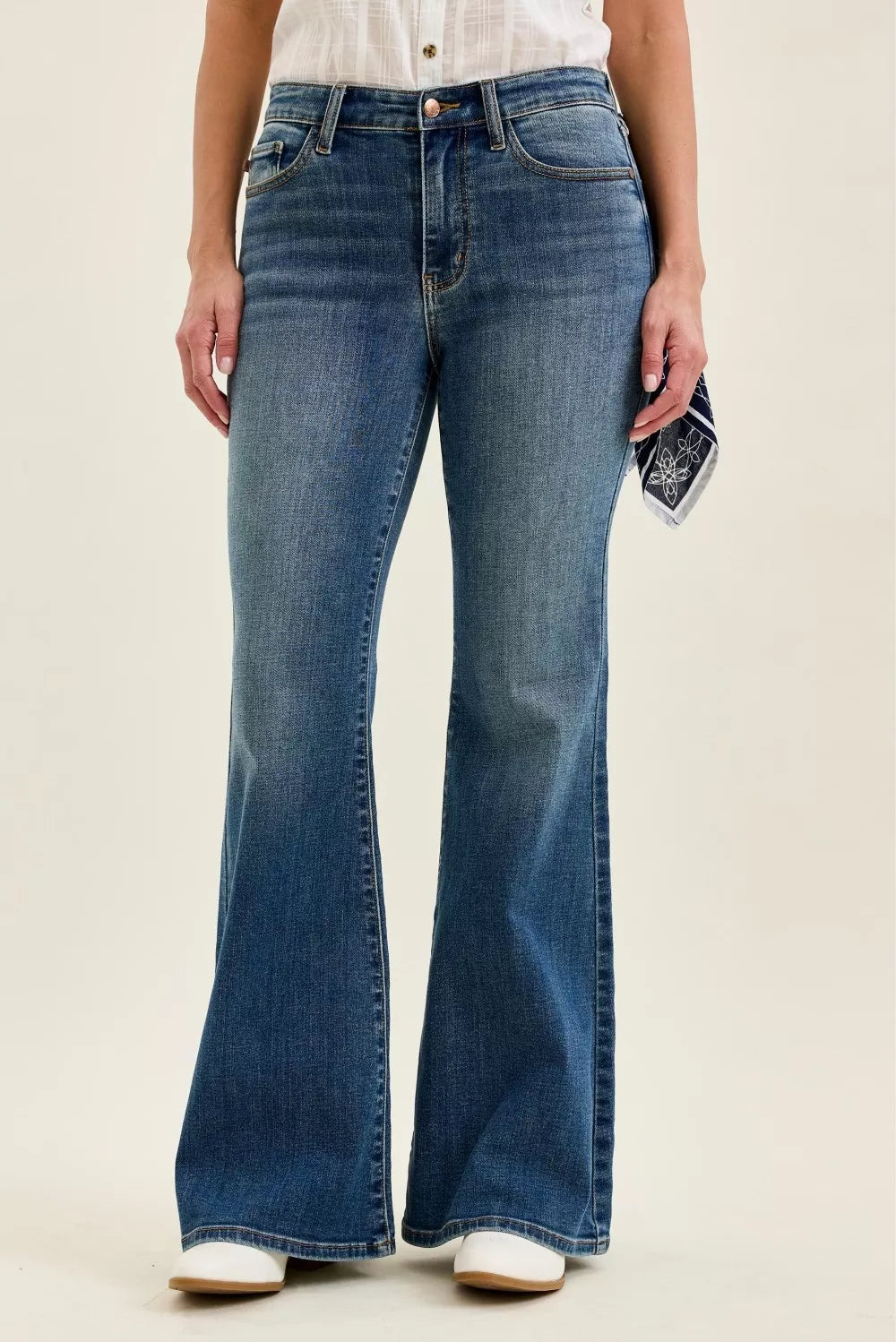 Judy Blue mid-rise flare jeans in medium wash; button-zip front and front pockets