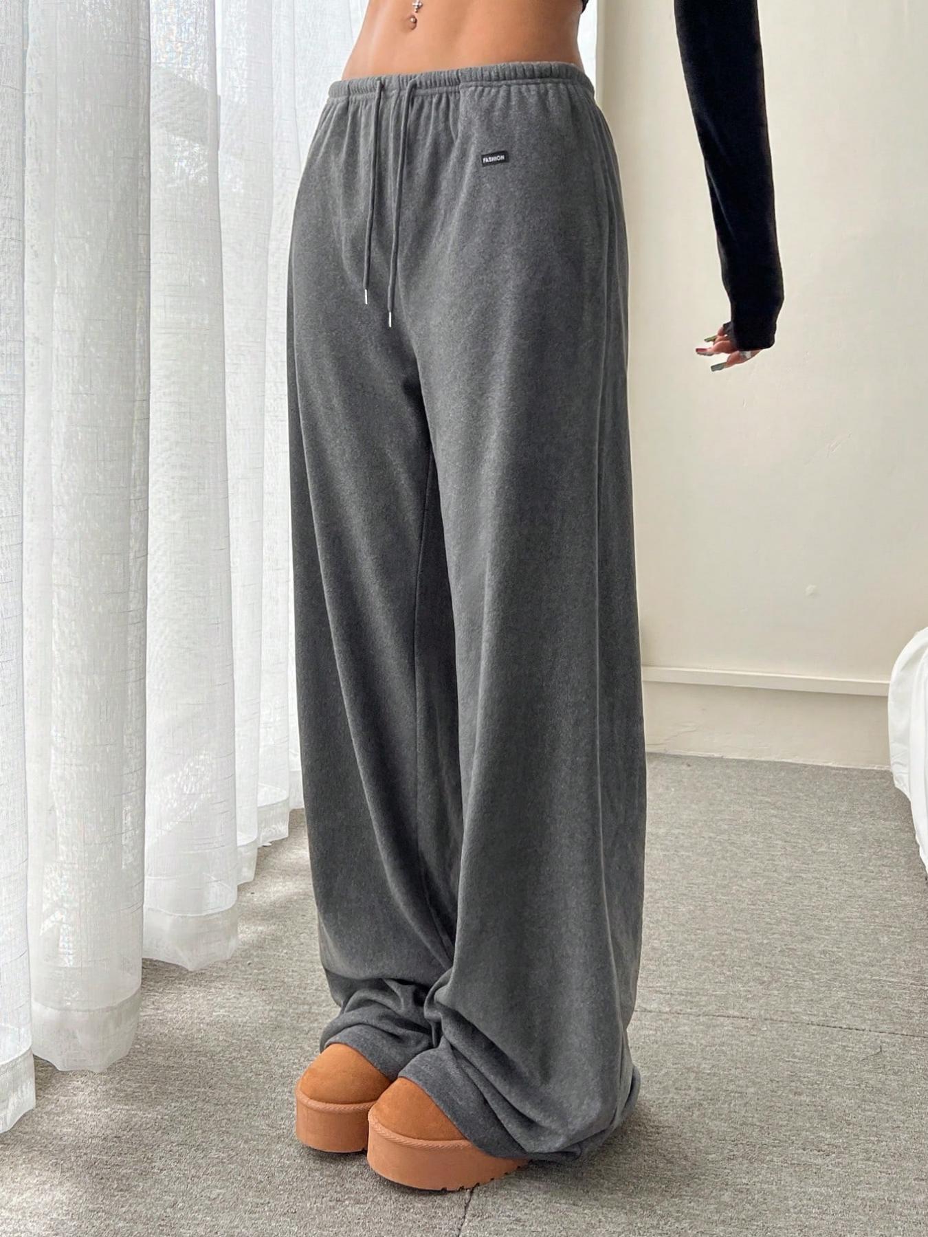 Gray sweatpants-style drawstring pants, relaxed fit with elastic waist
