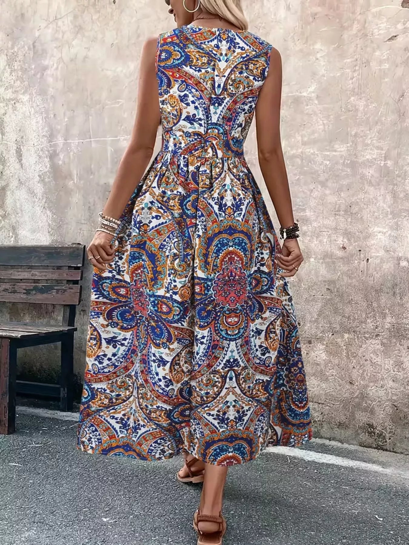 Blue paisley sleeveless long-top romper, back view with gathered waist