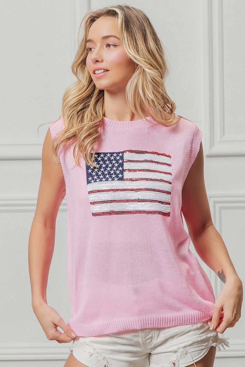 Pink sleeveless knit top with American flag sequin patch and relaxed fit
