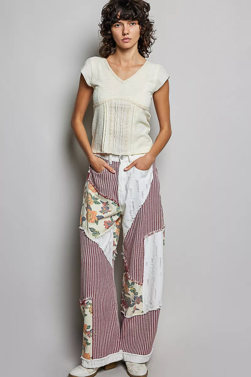 Cream knit top with V-neck lace trim and short sleeves, fitted textured front