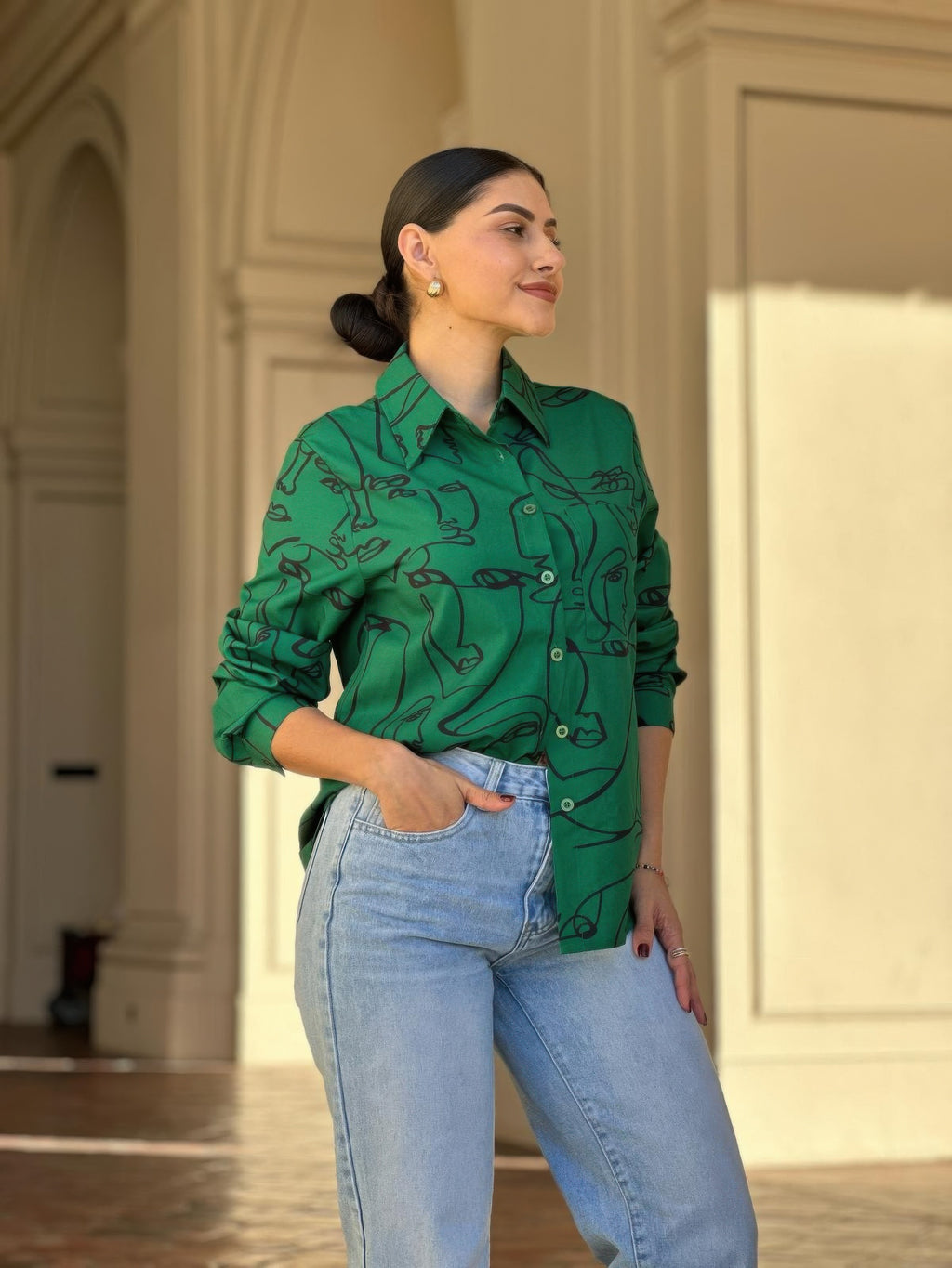 Green face-print long-sleeve button-down blouse with stand collar and small front buttons