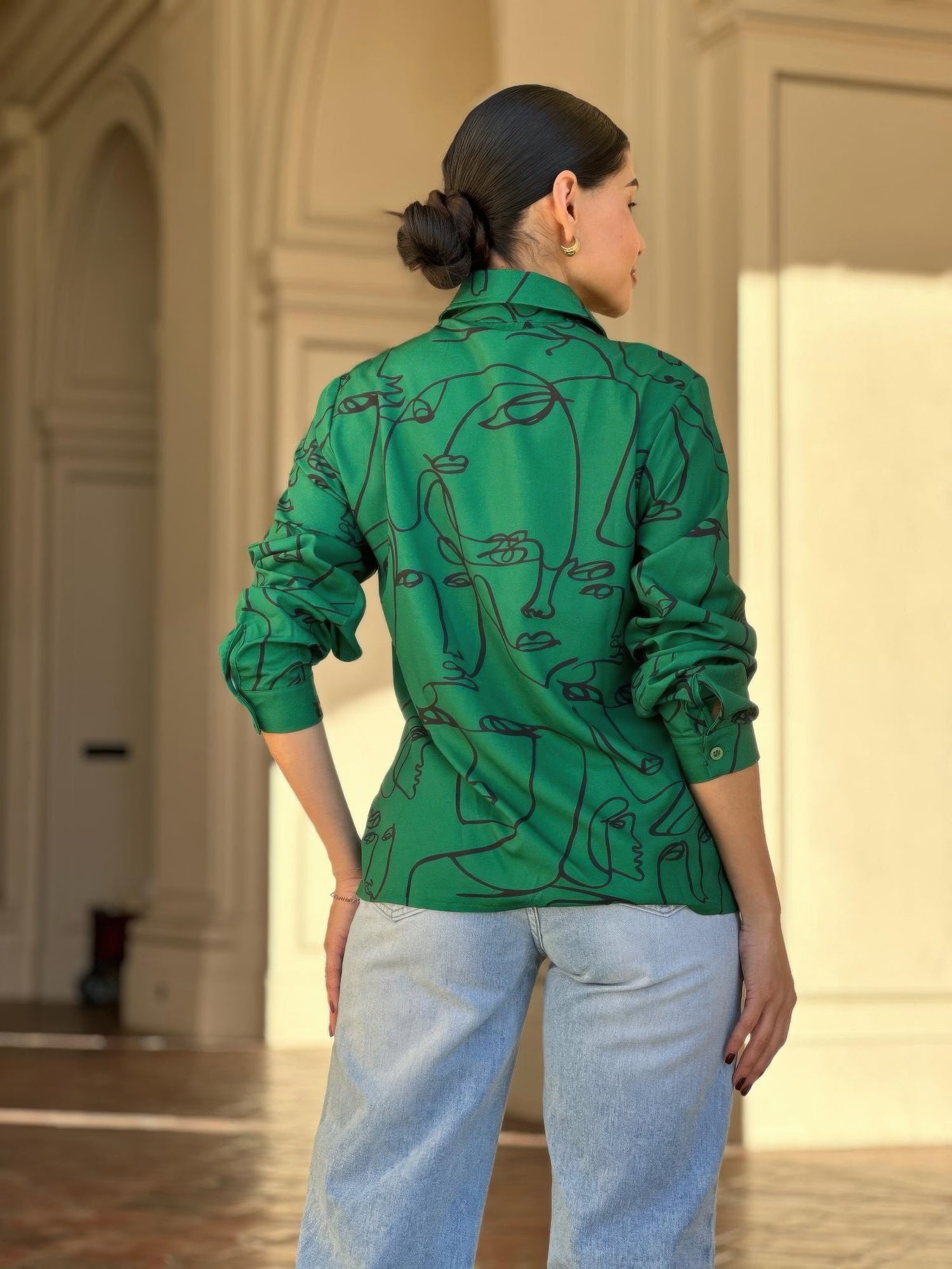 Green face-print button-up blouse back view with collared neckline and cuffs