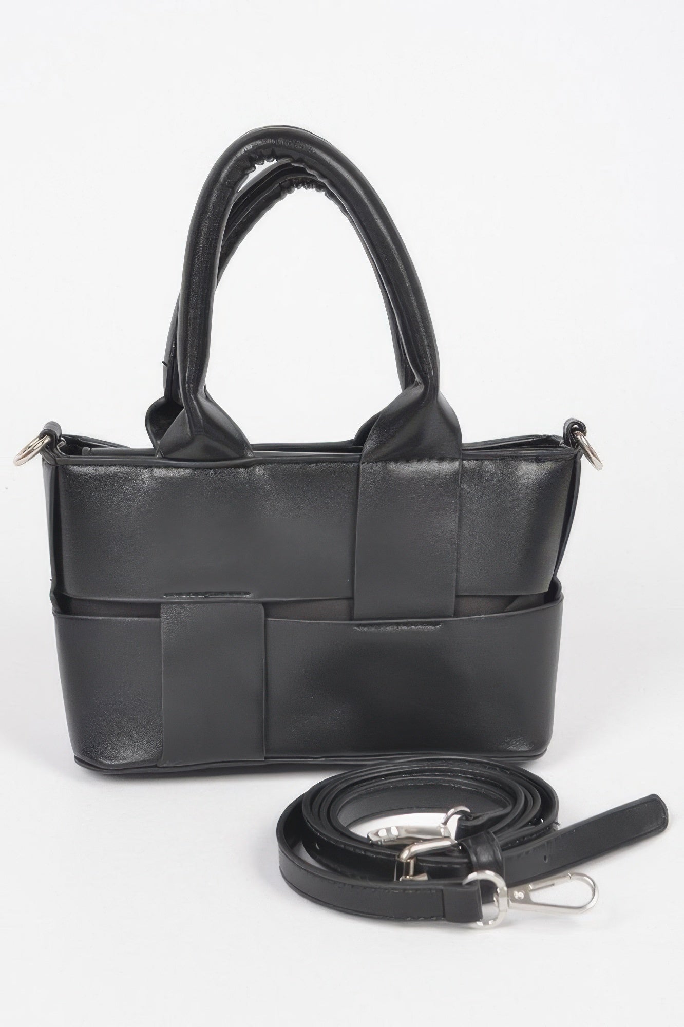 Black faux leather small tote bag with braided top handles and adjustable strap