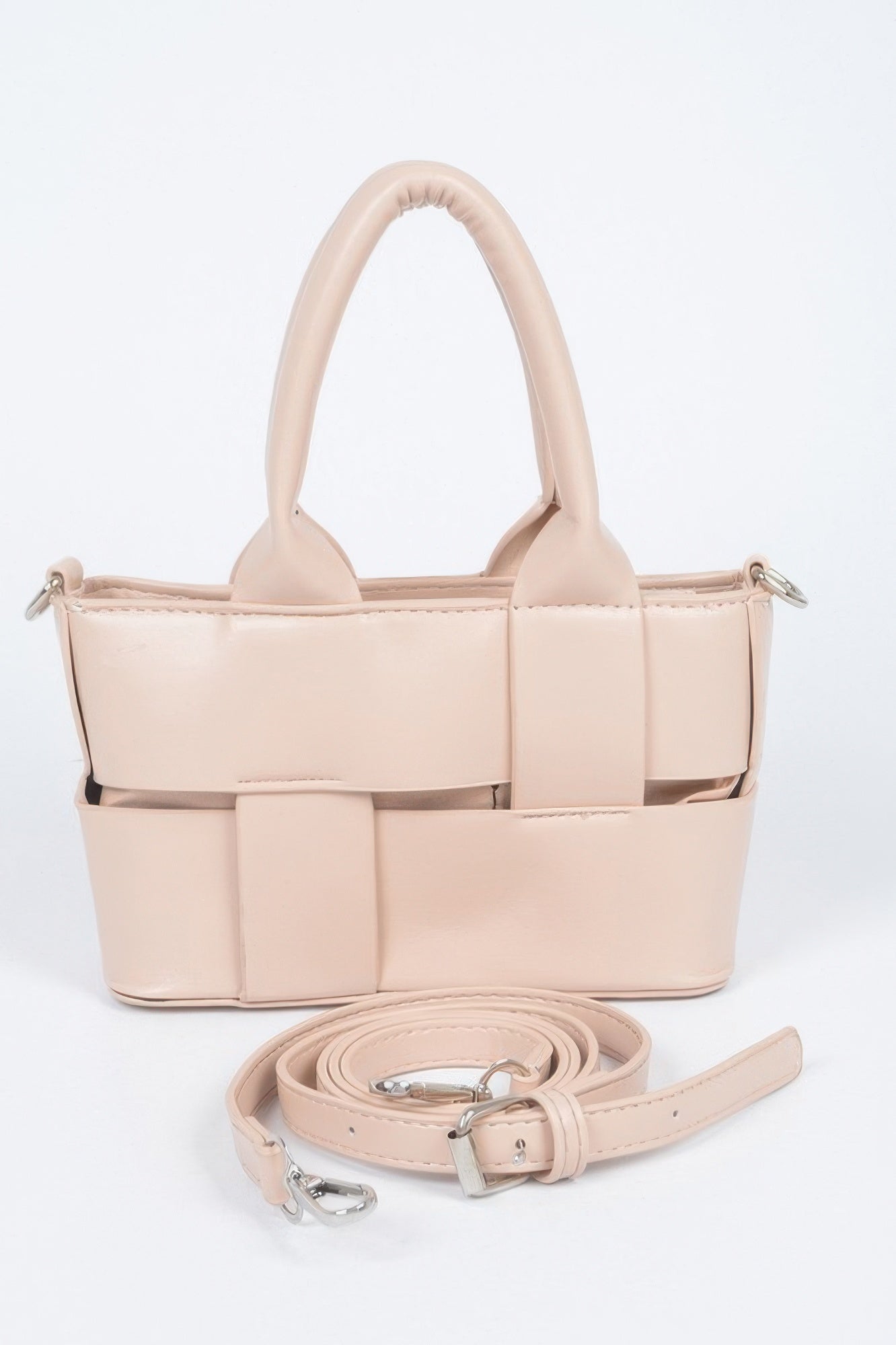 Nude faux leather small tote with braided handles, front braid panel, and crossbody strap