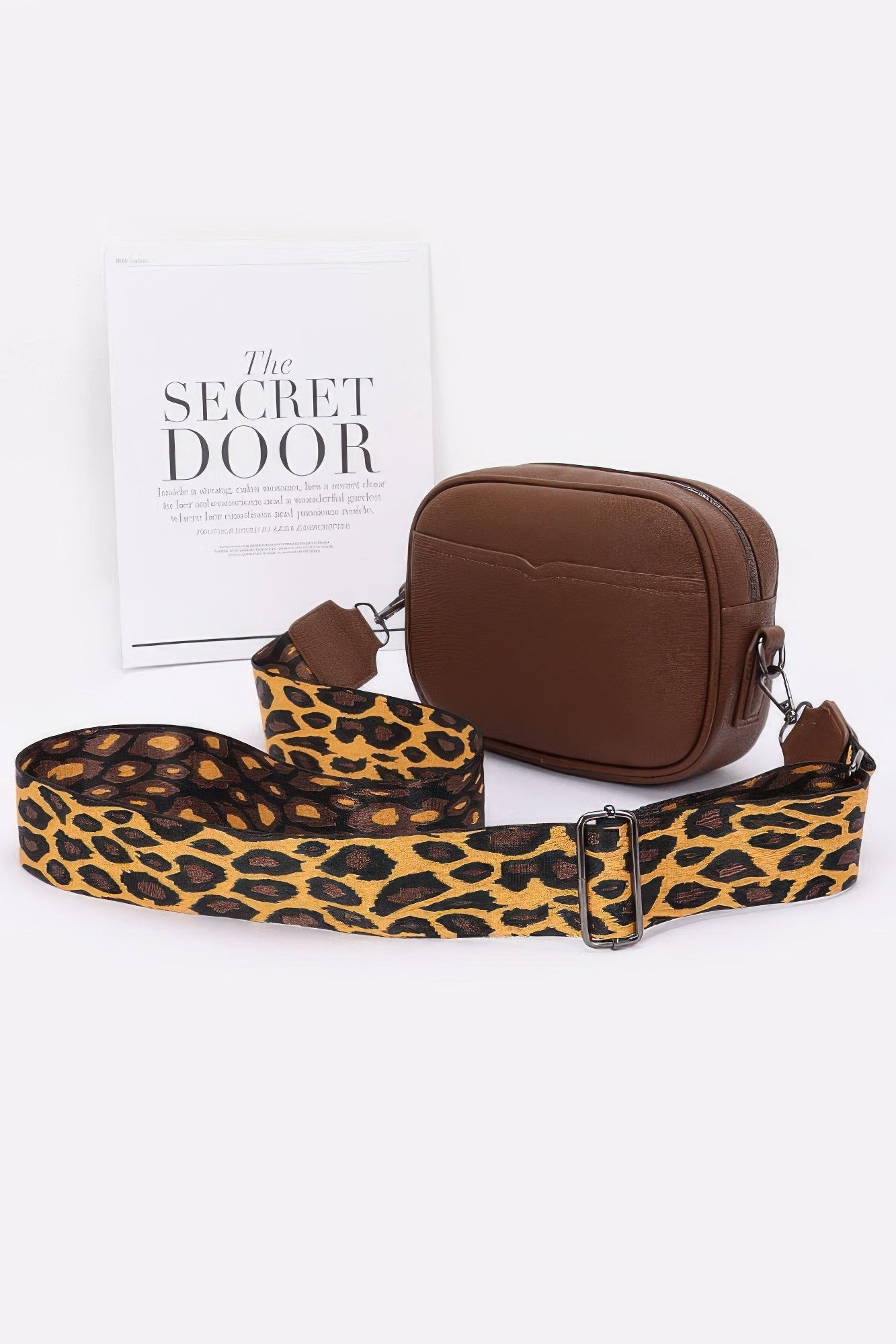 Brown faux leather camera bag with leopard print strap and silver clasp