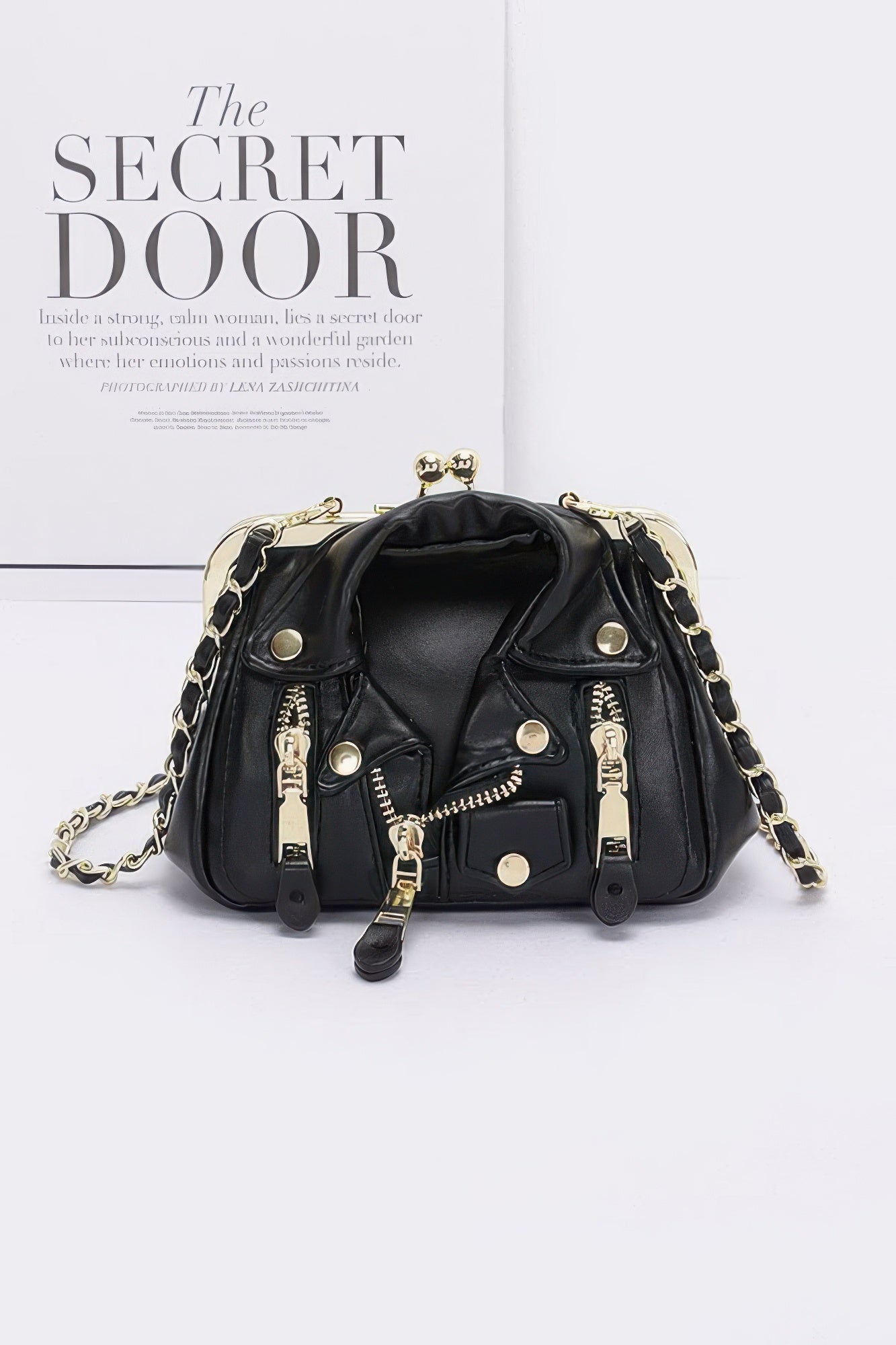 Faux leather crossbody bag, black with gold-tone frame and chain straps
