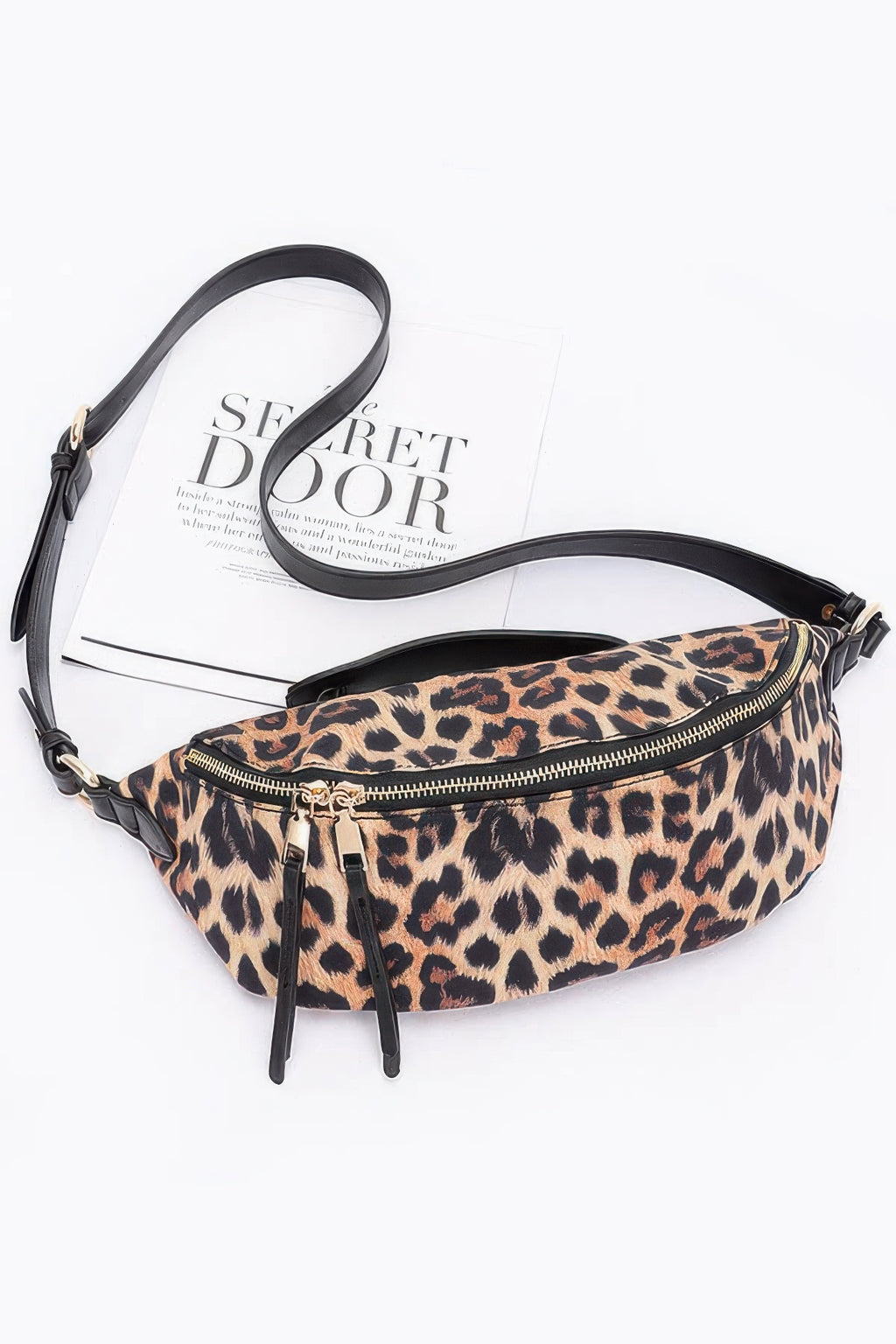Leopard print faux leather crossbody bag with black strap and zippered top