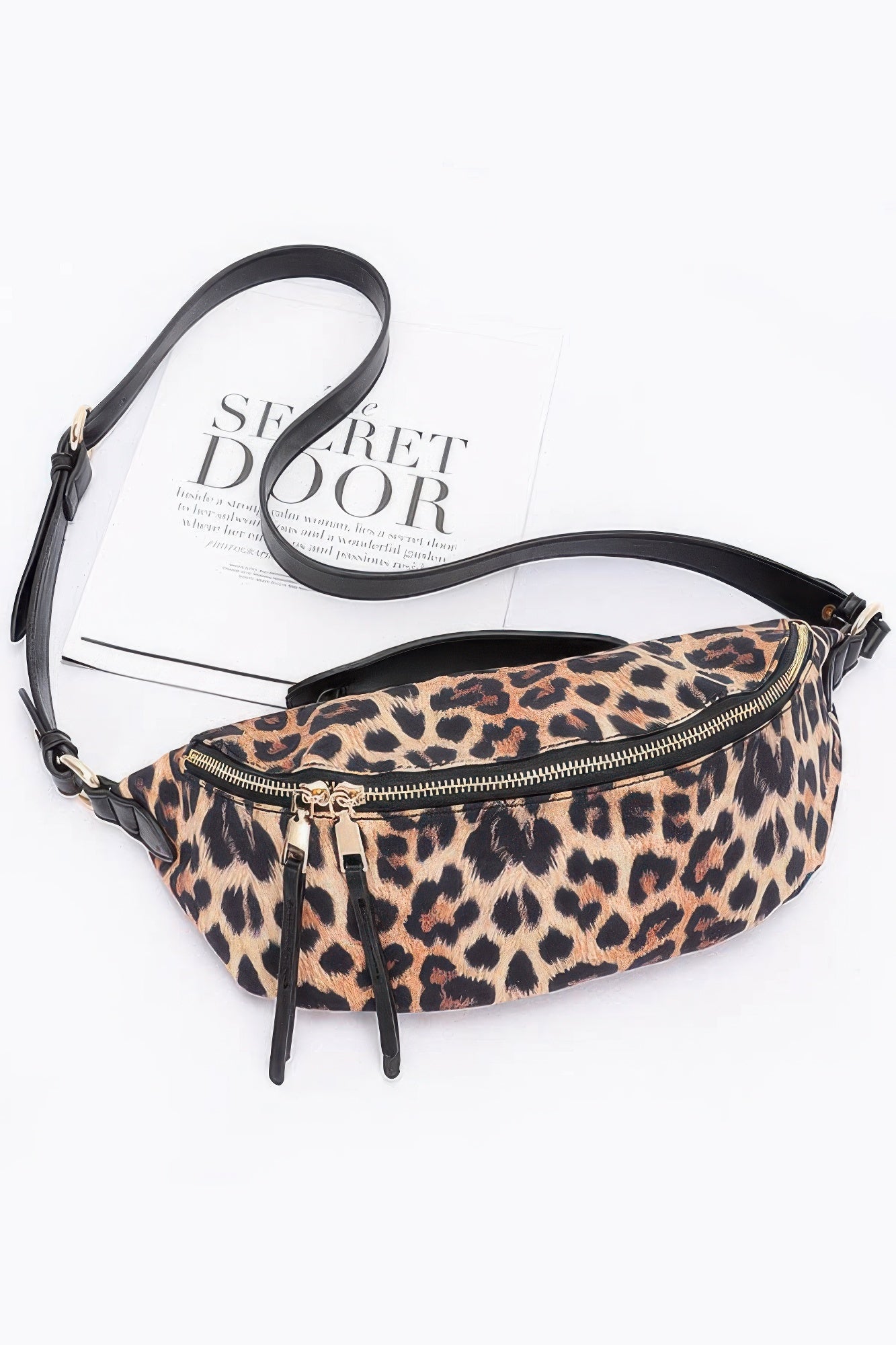 Leopard print faux leather crossbody bag with black strap and zippered top