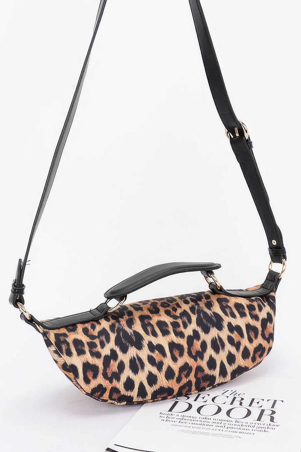 Leopard crossbody bag with adjustable black strap and gold-tone hardware