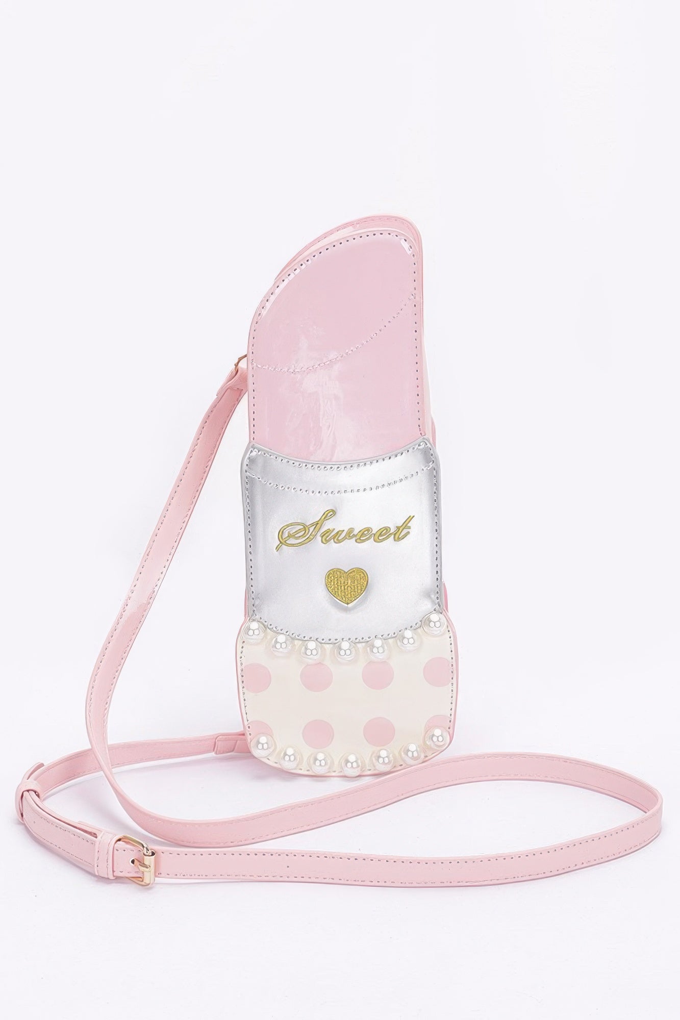 Pink faux leather lipstick novelty bag with “Sweet” logo, heart badge, and dot pattern