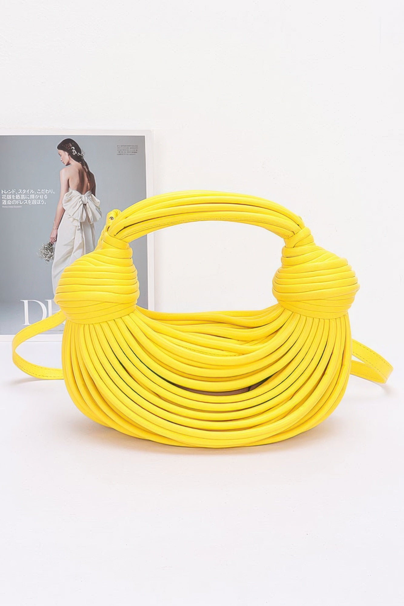 Yellow faux leather rope hobo bag with thick rope handle and crossbody strap