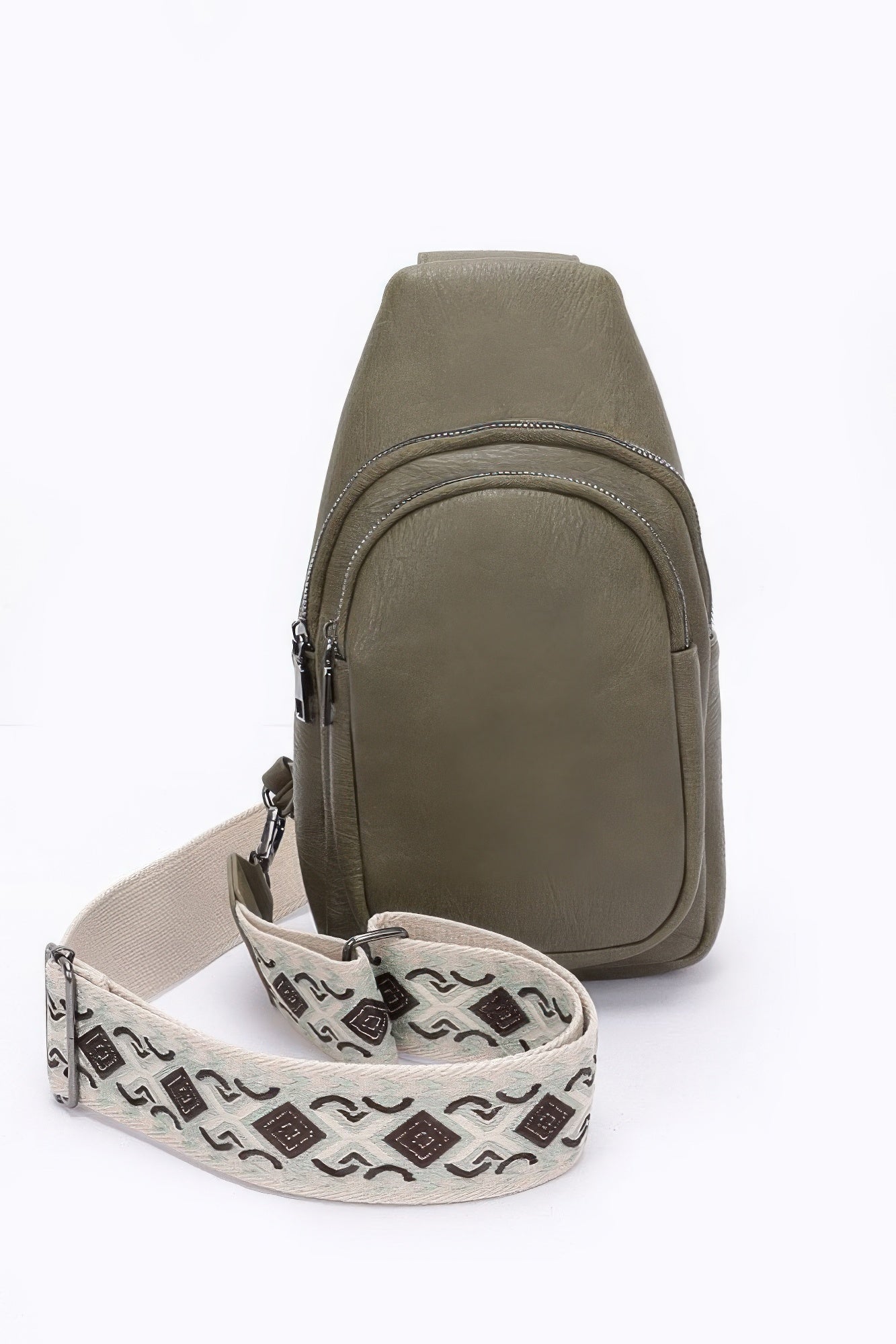 Olive faux leather sling bag with zip closure and patterned multi-color shoulder strap