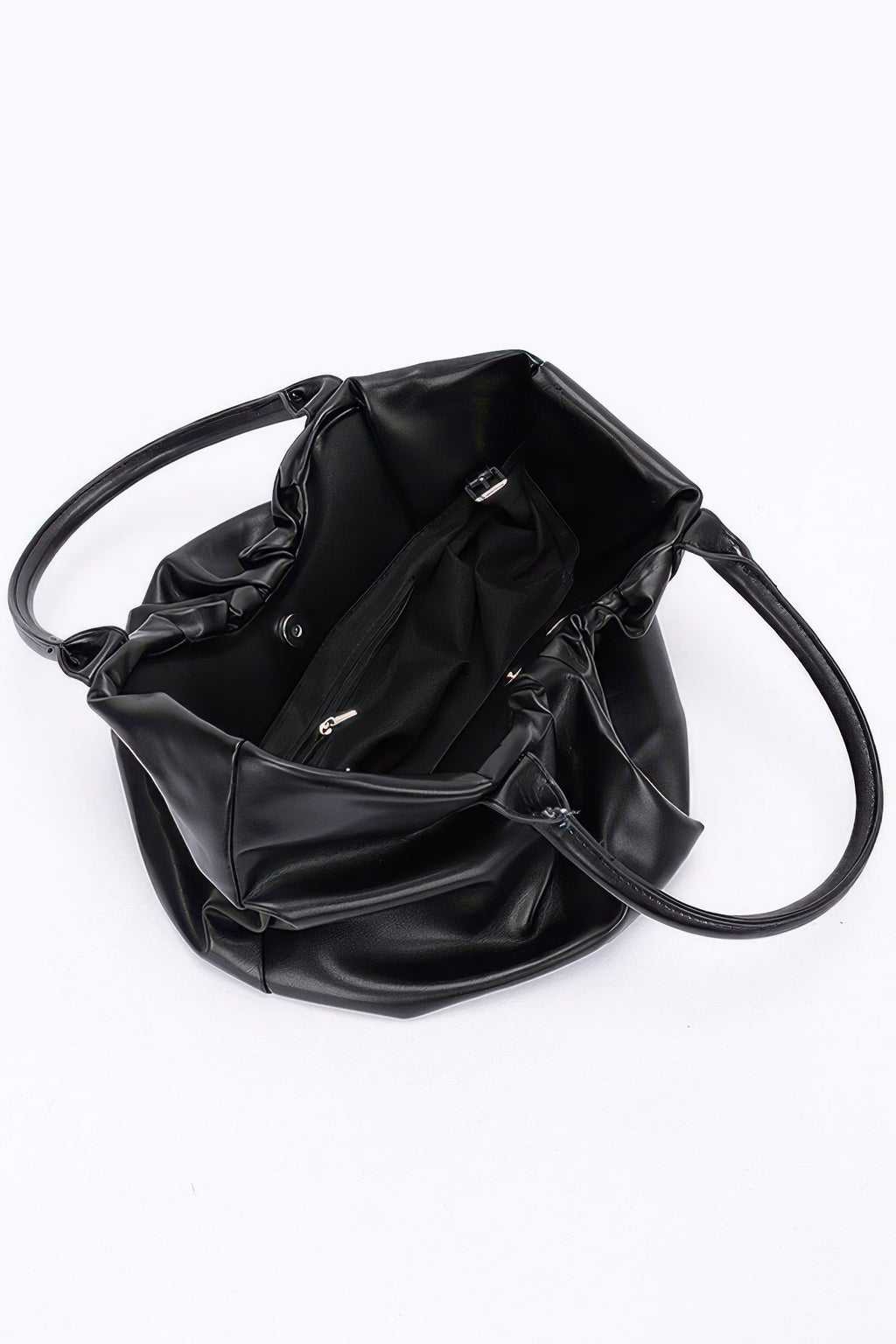 Black faux leather tote bag, open interior with pocket panel and crossbody strap