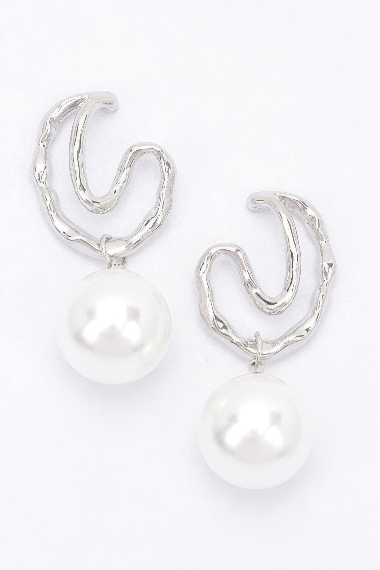 Silver-tone faux pearl drop earrings with twisted hoop design