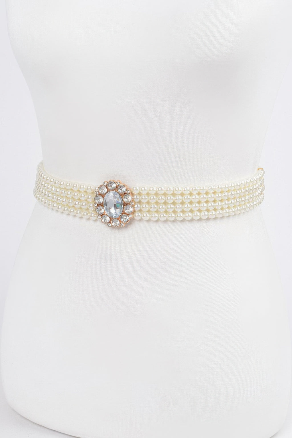 Ivory faux pearl stretch belt, front view with round rhinestone centerpiece